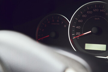 car dashboard and steering wheel. speedometer