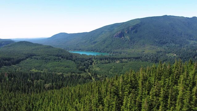 Pacific Northwest Nature Aerial with Green Trees and Turquoise Lake