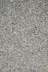 Pattern of gravel on road, grey stone pebbles background