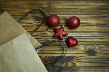 Brown kraft bags and Christmas tree decorations. The concept is New Year's hustle and bustle,...