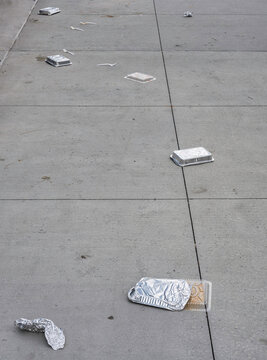 uncivil behavior at street with fast food trash