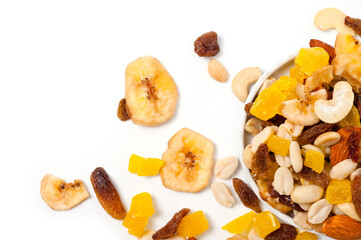 Fruit and nut assortment of peanuts, raisins, pineapple, almonds, cashews and bananas.