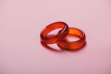 wedding rings on a red background