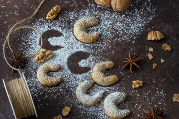 vanilla crescent cookies for Christmas, powdered sugar and walnuts for decoration © AndreaR
