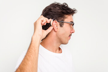 Young hispanic man wearing hearing aid isolated on white background