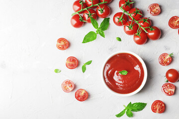 Tomato sauce in a bowl, Fresh basil and fresh cherry tomatoes. Ingredients for the sauce. Ingredients for cooking.