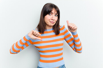 Young caucasian woman isolated on white background showing thumbs up and thumbs down, difficult...