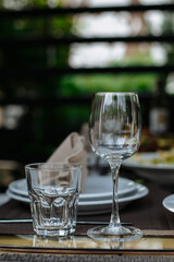 A table with beautiful dishes and prepared dishes on the summer terrace