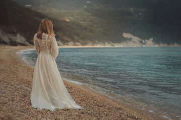 Fototapeta na wymiar Woman alone on a beach