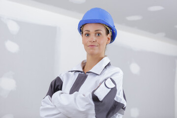 woman builder engineer standing with crossed arms
