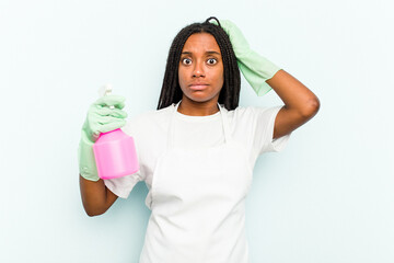 Young African American cleaner woman isolated on blue background being shocked, she has remembered...