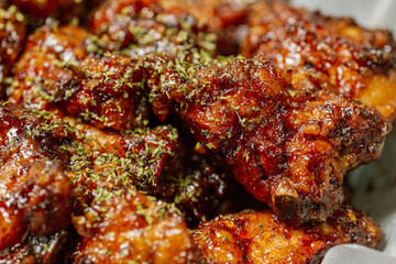 yangnyeom chicken, Korean style Seasoned Fried Chicken : This dish is seasoned chicken cut into pieces, deep- fried, and mixed with soy sauce, gochujang, or other sauces. It has a mild yet spicy taste