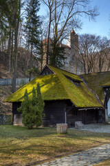Fototapeta premium Bran, Romania house, green moss on roof and Castle