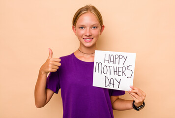 Fototapeta na wymiar Little caucasian girl holding happy mothers day isolated on beige background