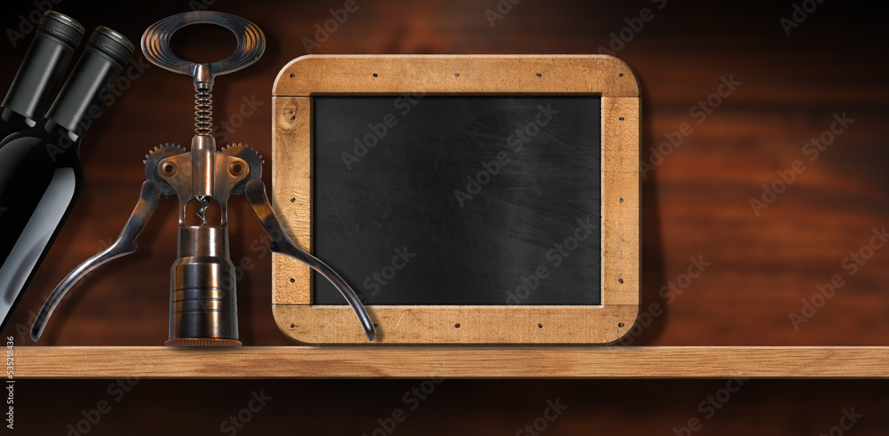 Poster close-up of two black bottles of wine and a corkscrew on a wooden table or shelf with empty blackboa