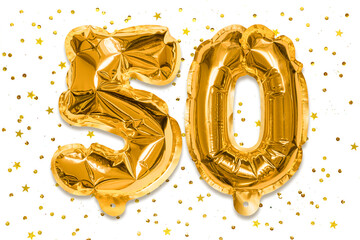 The number of the balloon made of golden foil, the number fifty on a white background with sequins....