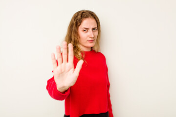 Young caucasian woman isolated on white background rejecting someone showing a gesture of disgust.