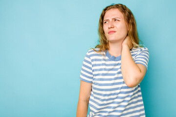 Young caucasian woman isolated on blue background touching back of head, thinking and making a choice.