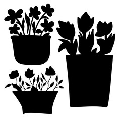 Set of silhouettes of baskets with flowers in doodle style