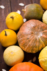 ripe pumpkins on a wooden background