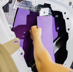 Car tuning. Sound insulation of the car. Installation of sound insulation material on the car....