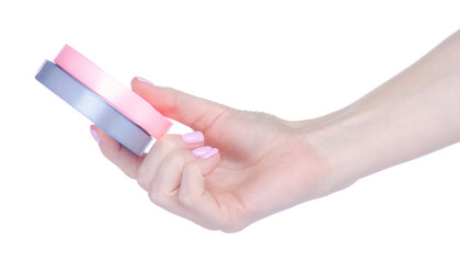 Roll pink and gray ribbon in hand on white background isolation