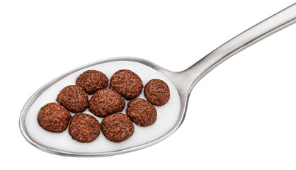 Chocolate corn balls with milk in spoon isolated on white background