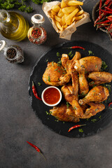 Mix of baked chicken pieces.