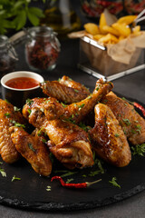 Mix of baked chicken pieces.