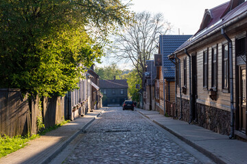 A cobbled old town street on a summer evening