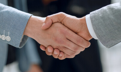 Close up handshaking businessman partner successful concept