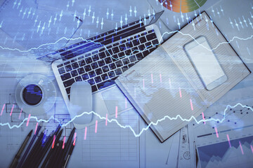 Multi exposure of forex chart drawing over table background with computer. Concept of financial research and analysis. Top view.