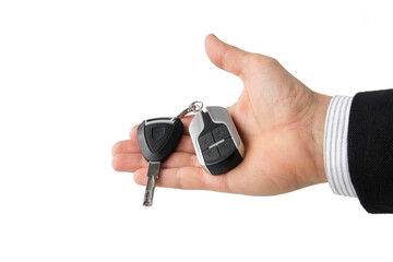 Businessman holding keys to electric motorcycle isolated