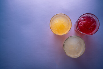 glasses set with fruit fresh colored juice of berry, lemon, ginger, strawberry