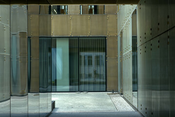 An inner courtyard between the glass facades of an office building in Berlin.