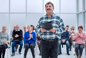 Fototapeta premium Speaker giving a talk on corporate Business Conference. Audience