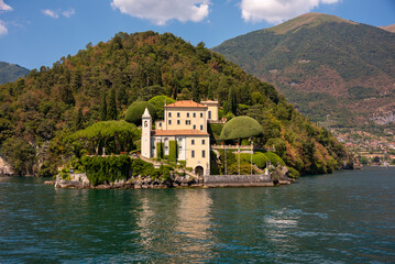Fototapeta na wymiar Beautiful panorama of lake Como with a small coastal town, famous tourism destination