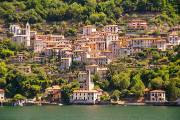 Beautiful panorama of lake Como with a small coastal town, famous tourism destination