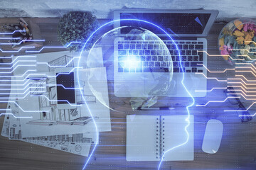 Double exposure of brain drawing hologram over topview work table background with computer. Concept of big data.