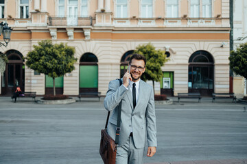 Close up shot of businessman's hand holding smart phone. Communication technology concept. Cinematic color grade.