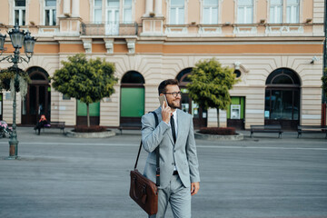 Close up shot of businessman's hand holding smart phone. Communication technology concept. Cinematic color grade.
