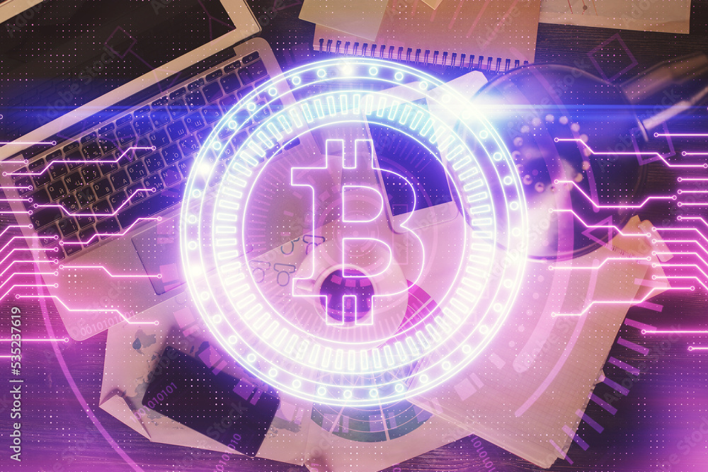 Poster Blockchain theme hologram drawings over computer on the desktop background. Top view. Double exposure.
