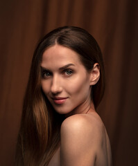 portrait of a young attractive woman on a dark background