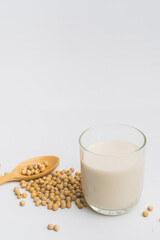 Health Benefits of Soy Milk,Soy milk in glass and soya bean isolated on white background