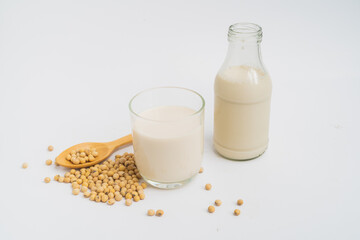 Health Benefits of Soy Milk,Soy milk in glass and soya bean isolated on white background