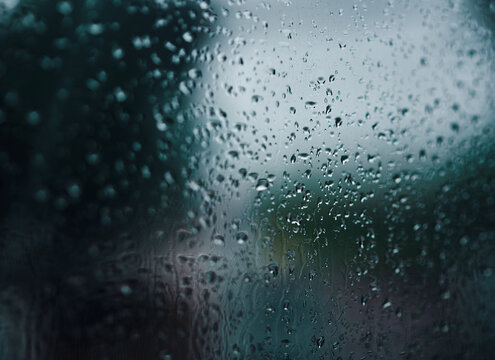 Close-up view of the wet glass on a rainy day