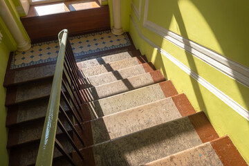 Photo of staircase in residential house. Typical building in historical center in Saint Petersburg, Russia. Steps with forged fence. apartment house.