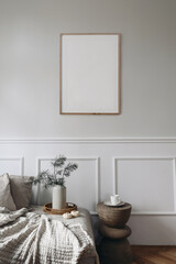 Moody Christmas interior. Blank vertical wooden picture frame mockup. Moulding wall background.....