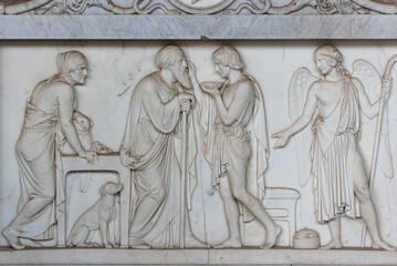 Fototapeta na wymiar Biblical passage of angel visiting prophet carved in marble wall