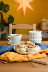 Baked apples in puff pastry. Breakfast with a cup of tea on the table.